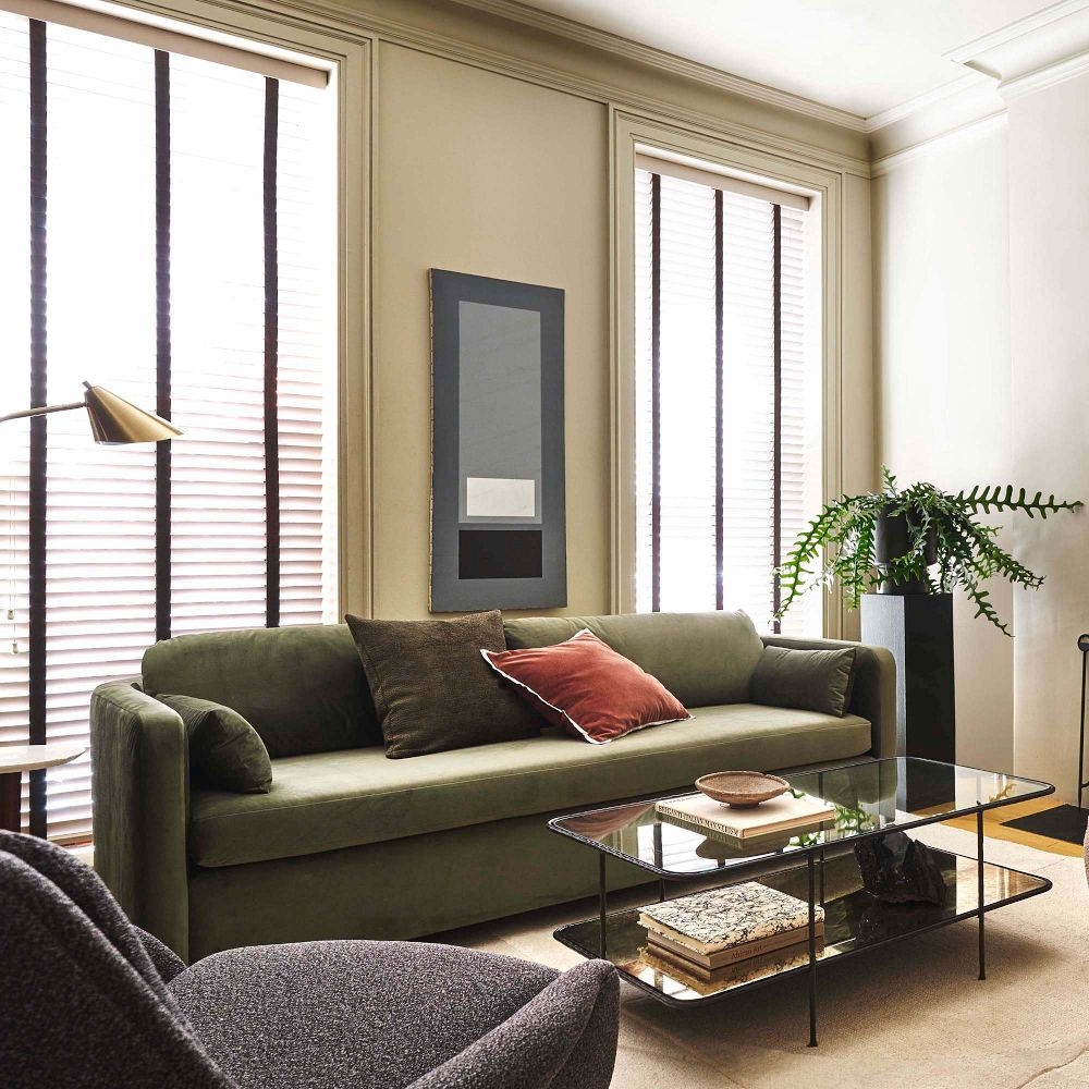 Green curved sofa top