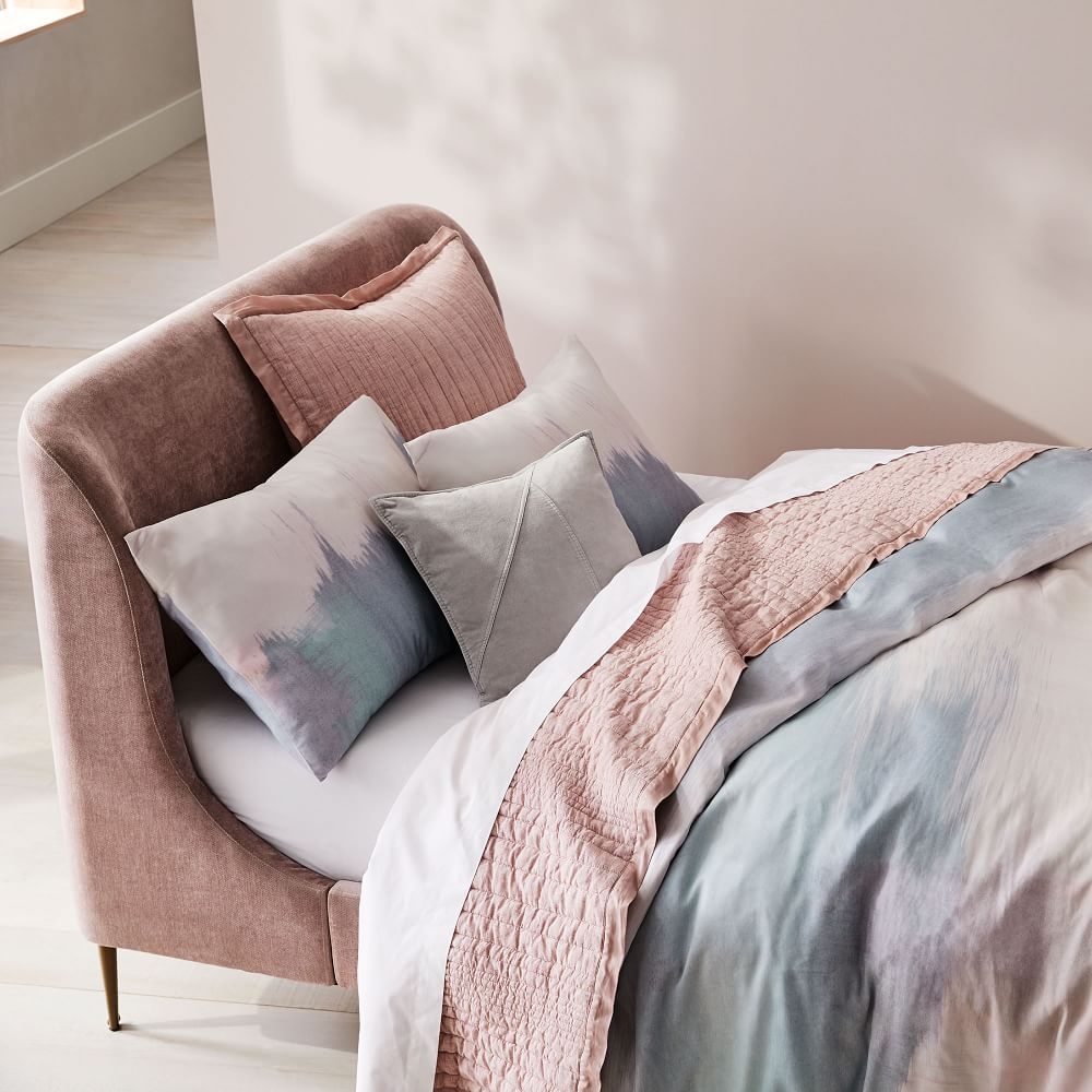 Blush pink upholstered shop bed
