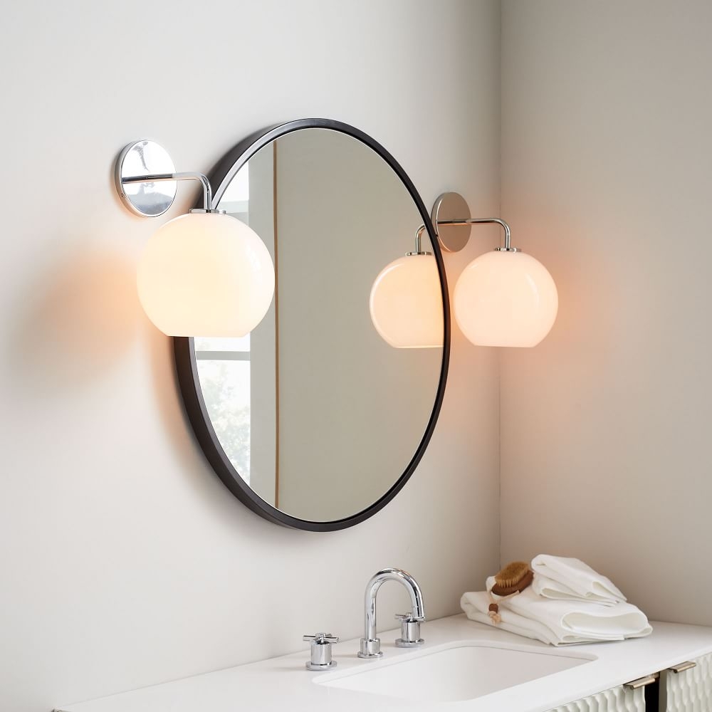 Round mirror on sale with sconces