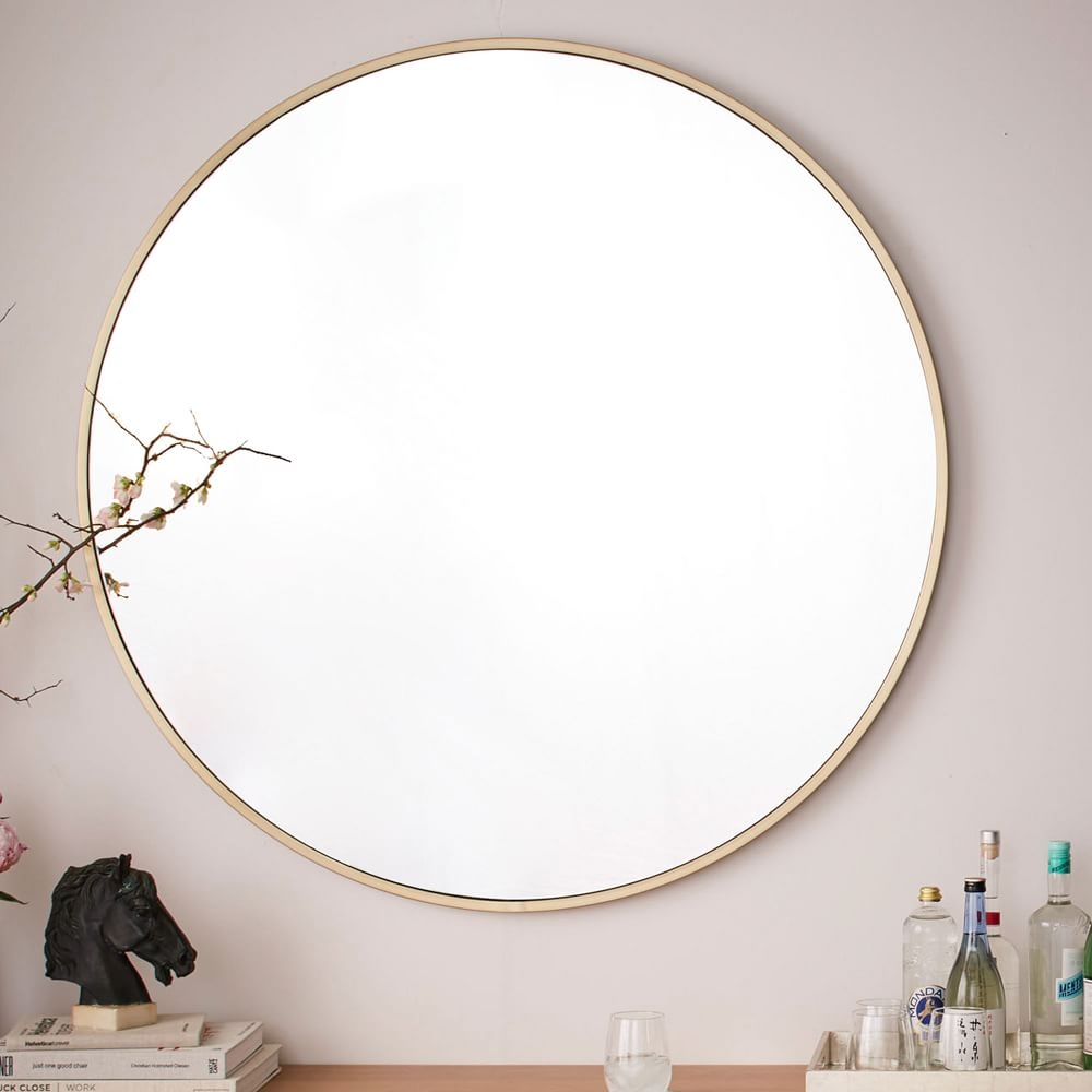 Framed round store mirror