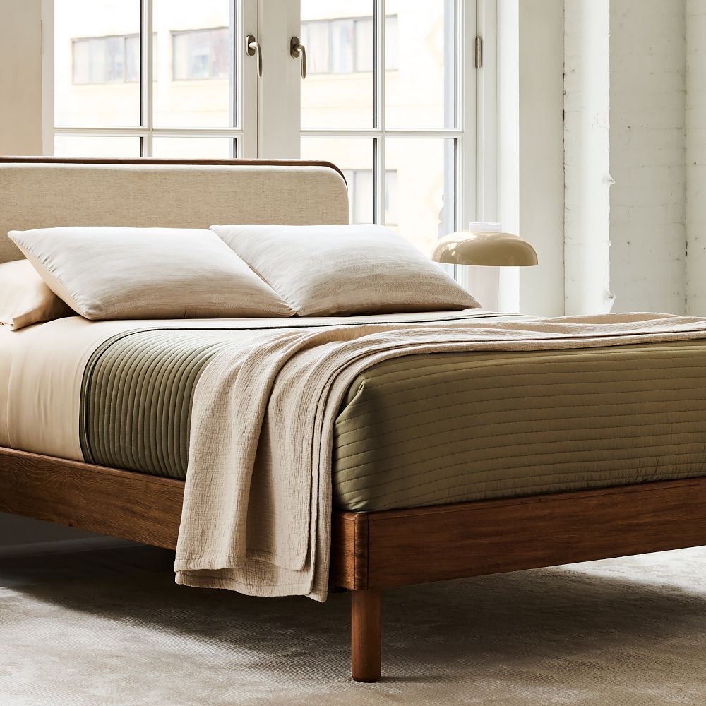 Solid wood upholstered hot sale bed