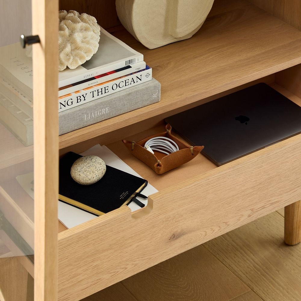Tall glass front outlet cabinet