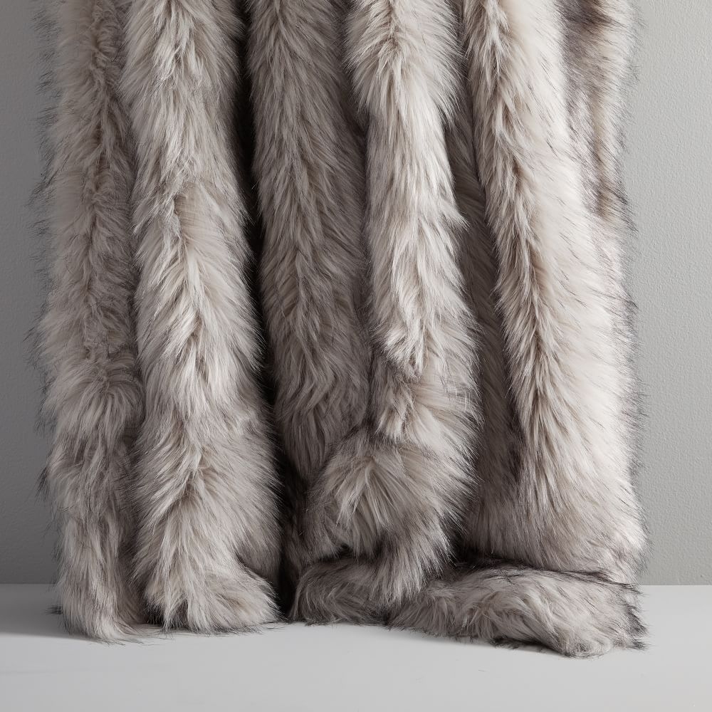White fur shop throws and cushions